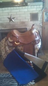Bob Avila show saddle. 16" seat. Quality silver basket weave/floral combination.