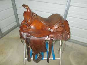 Older 15" Hereford Tex Tan roping saddle with some tooling and leather seat