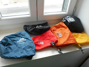 set of 3 Karrimor dry bags and 2 Mountain equipment stuff sacks & rain cover