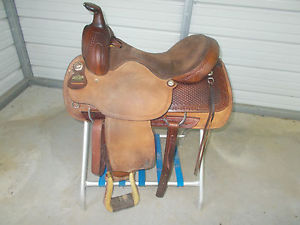 16" Brown Big Horn Roping saddle with rough out leather and barb wire design