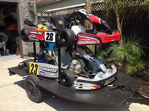 Go-karts , pair of cars with custom trailer and new neck brace