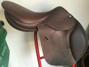 Butet Saumur Sellier Saddle with saddle cover and seat cover.