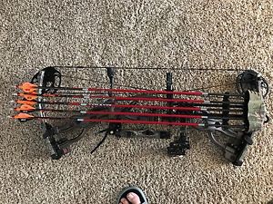 hoyt carbon spyder zt30 harvest brown with a fuse 5 pin sight and 5 arrow quiver