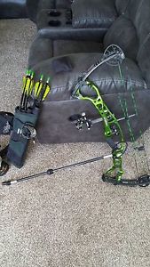 hoyt pro edge elite compound bow, green, slightly used, comes with accessories.
